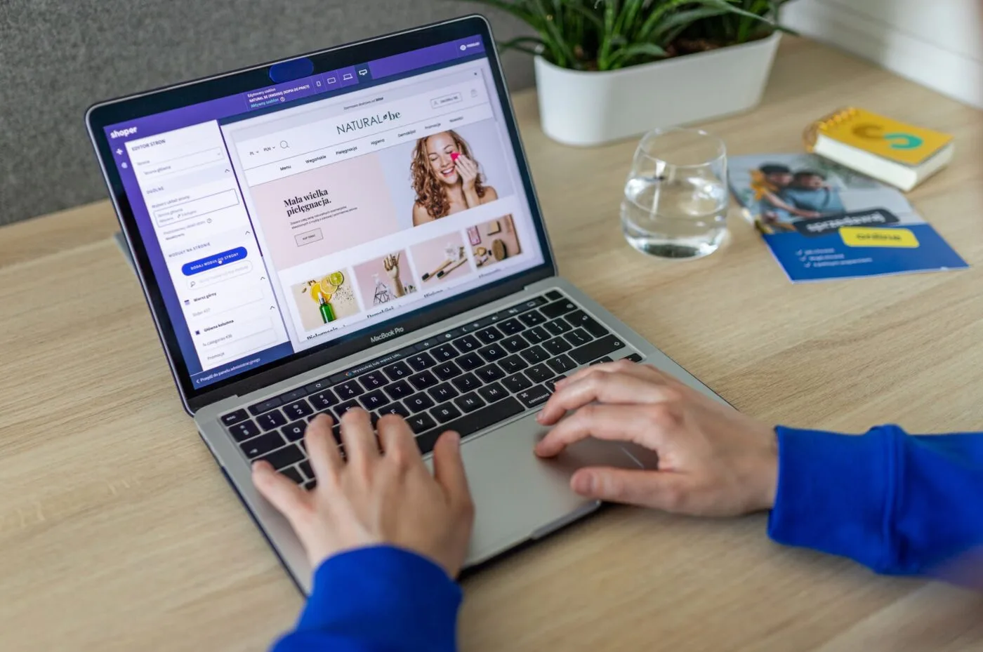 A web designer building a WordPress small-business website on a laptop